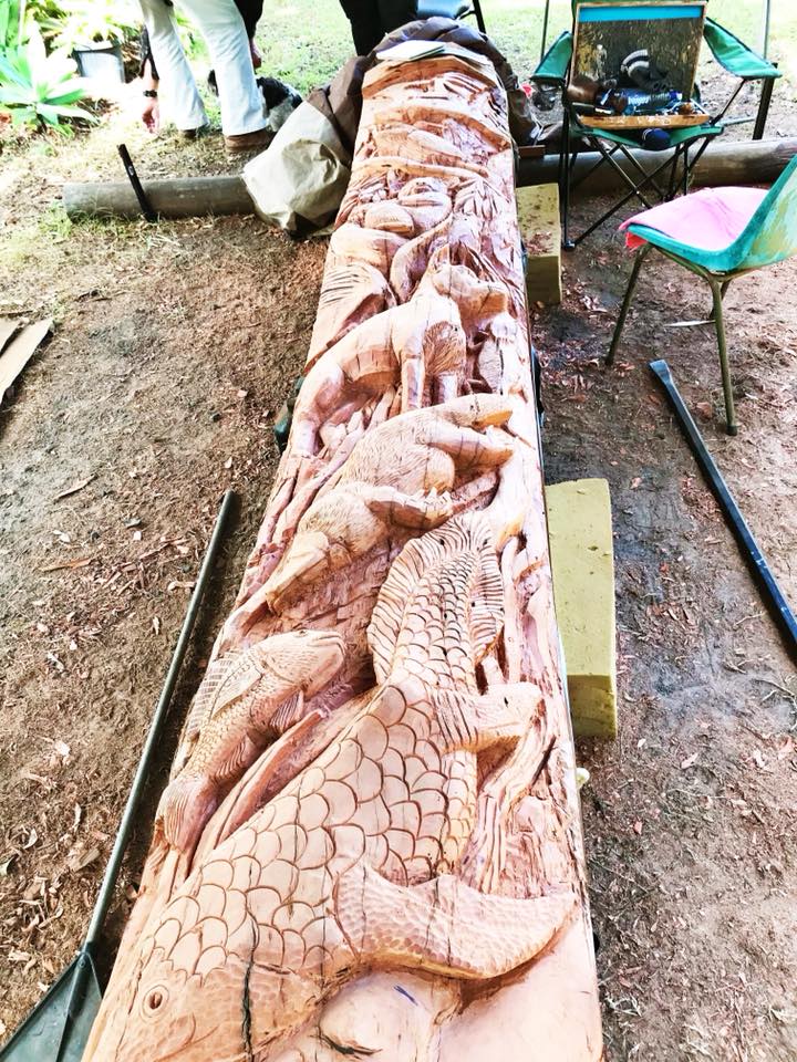 Wood carving on first side of peace pole. Photo: Daniel Sanderson.