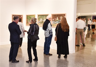 Gallery visitors take in opening exhibition Wildflowering by Design. Photo: Alistair Brightman