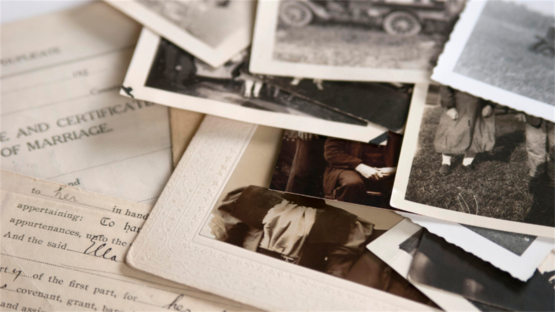 Image of old discoloured documents and photos