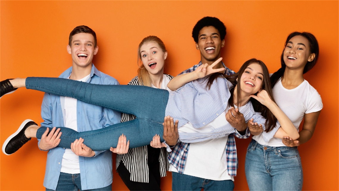 A group of teenagers that look like they are having fun laughing at camera