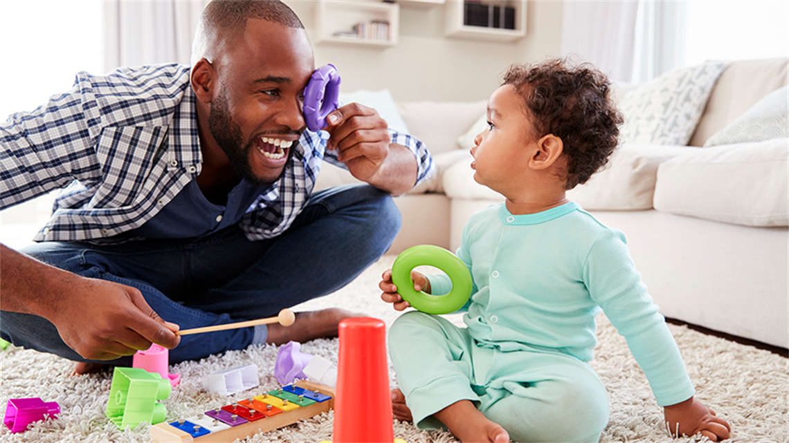 Parent playing with toddler