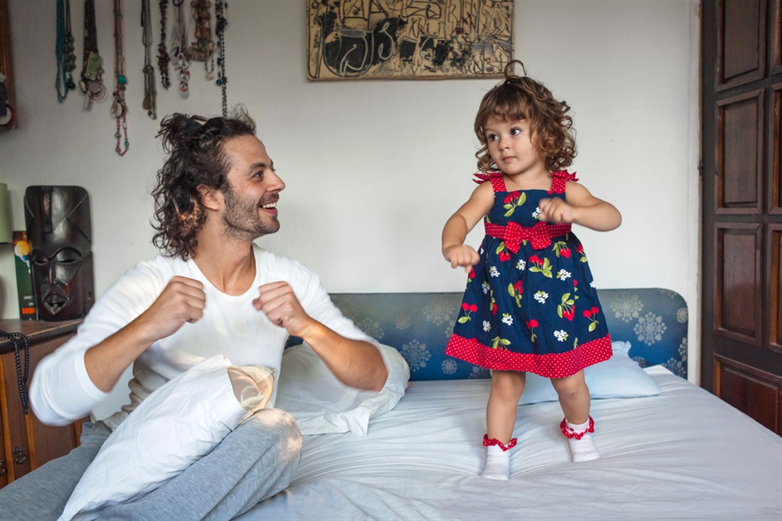 Toddler dancing with parent Toddler dancing with parent