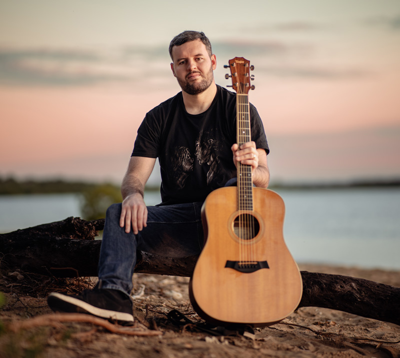 Aaron Westlake - Musician Holding Guitar