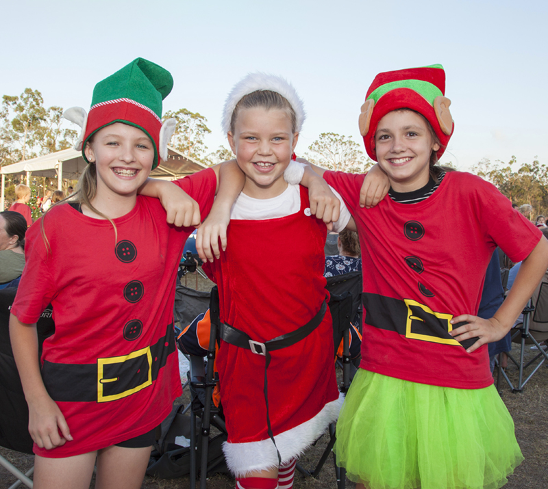 Three kids dressed in festive attire