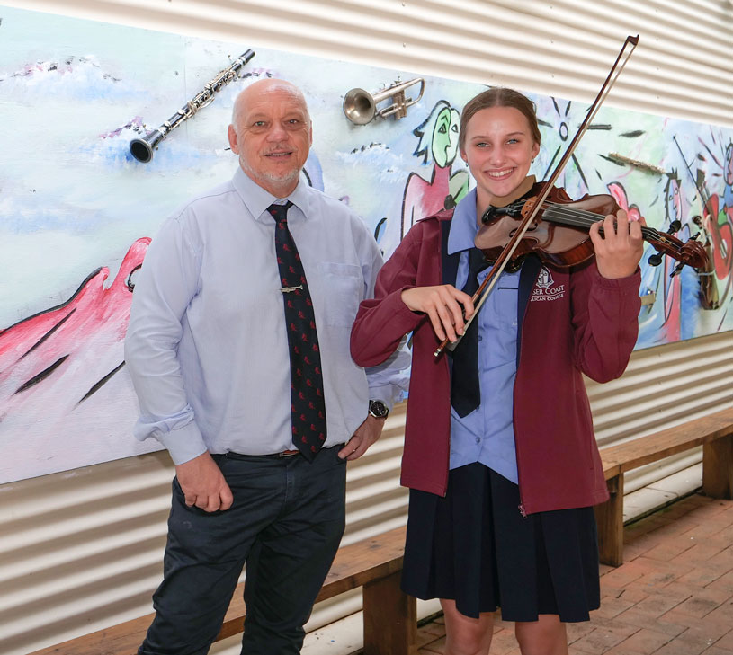 Ian Slater, RADF Advisory Committee member and Fraser Coast Anglican College Director for Visual and Performing Arts with Jennifer Bebington, Fraser Coast Anglican student. Part of the Song to the Ocean Music Residency project funded by RADF.
